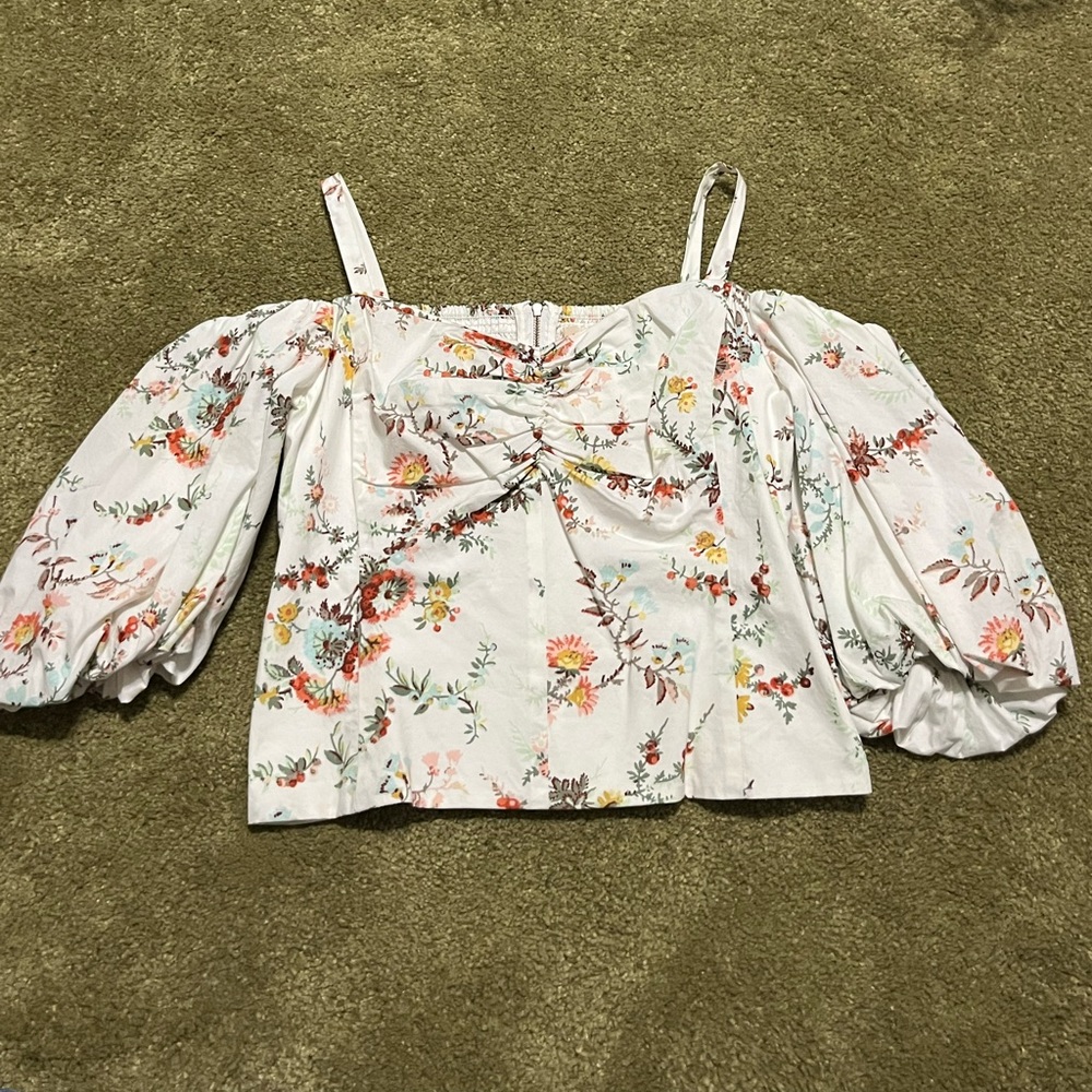 Off shoulder puffy sleeved top, says large (assuming kids?)but fits a women xs-s